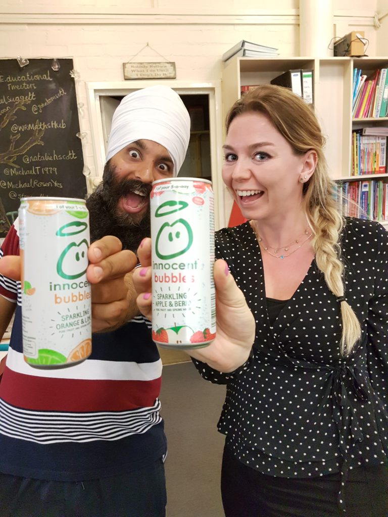 two ecstatic people holding innocent bubbles samples