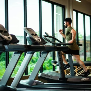 Gym Sampling Sub-Header showing a man running on a treadmill